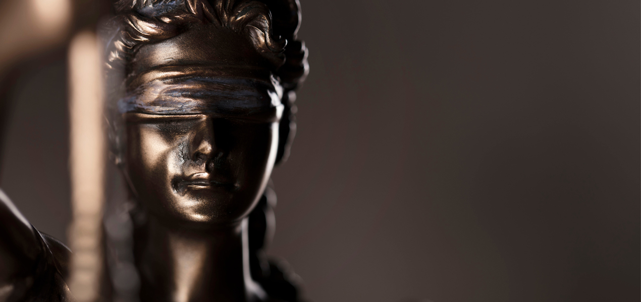 Close up of a bronze Statue of Justice.