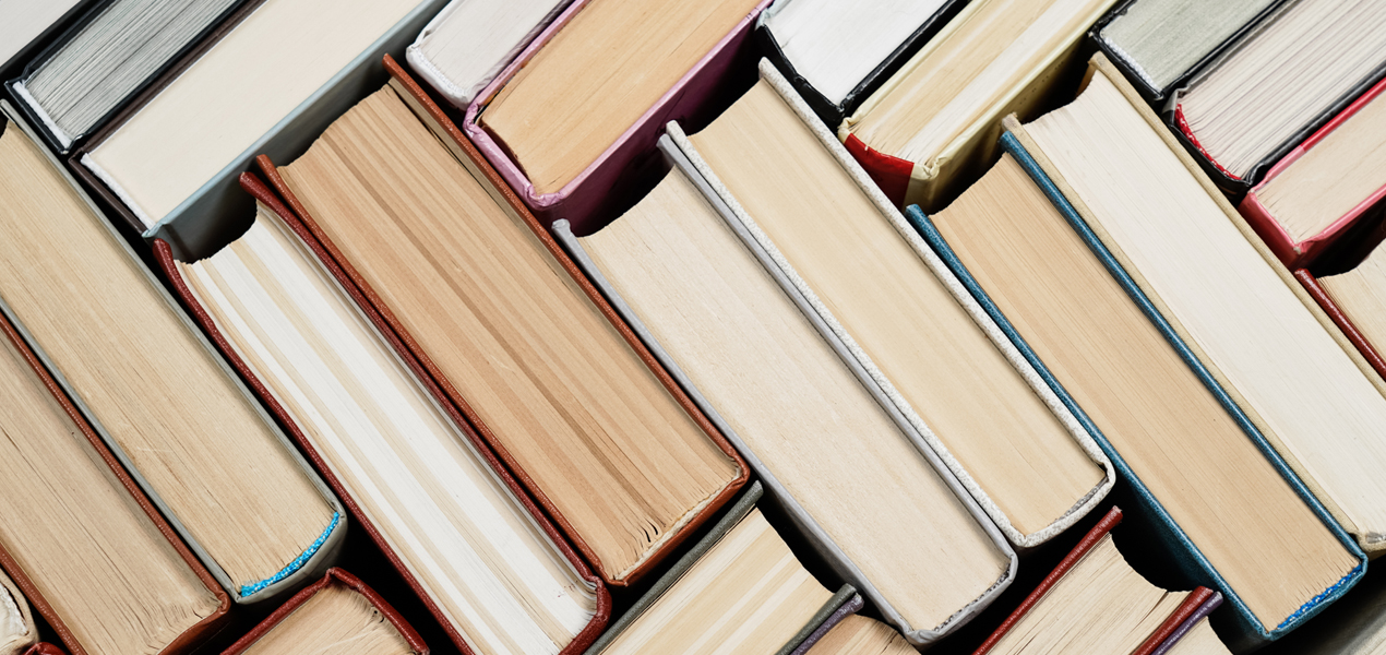 Books stacked in a chevron pattern.