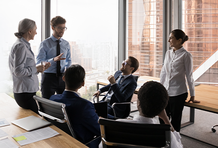 Group of business people brainstorming in an office.