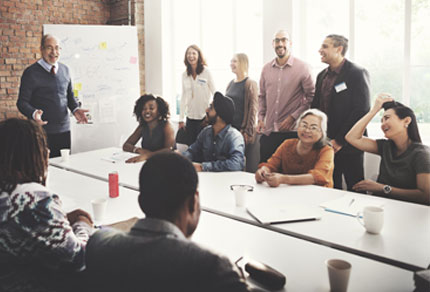 A team gathered in a meeting room and having a discussion.